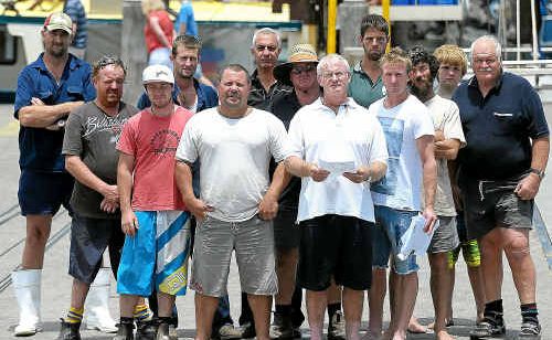 Russel Kerr, front right, from Coffs Harbour Fishermen’s Co-op, meets with other disgruntled fishermen. Russel Kerr, front right, from Coffs Harbour Fishermen’s Co-op, meets with other disgruntled fishermen.